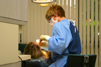 Dentist looking into patient's mouth